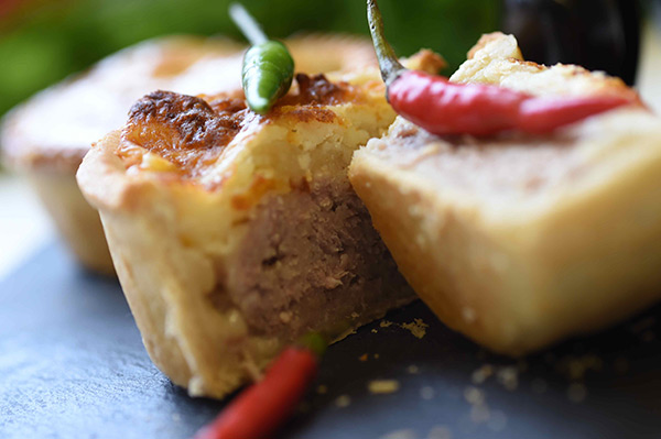 Pork pie with a hint of chilli and a cheese topping